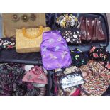 Two wheeled suitcases and contents, a collection of lady's accessories to include bags,