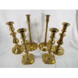 Three pairs of good quality brass candlesticks