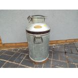 A Country Dairies milk churn 66 cm (h).