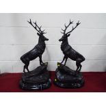 A pair of good quality cold cast bronze stags set on an Italian marble plinth, signed,