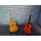 Two good quality beginners six string acoustic guitars (2)