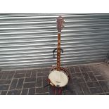 A good modern Audition five string Banjo, wooden armrest, 28 cm diameter head,