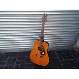 A Yamaha FG-200 six string acoustic guitar, serial no 0592369,