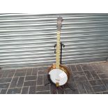A Broadcaster five string banjo by J & A M London (the 5th peg removed to create four string