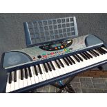 A Yamaha PSR-240 electronic keyboard,