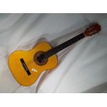 An acoustic guitar the paper label within scribed Herald,