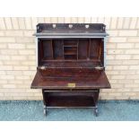 A mahogany bureau with pigeon hole interior,