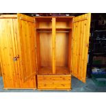 A good quality pine wardrobe with two drawers 177 cm (h) x approx 52 cm x approx 87.