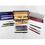 A collection of approximately thirteen pens and one propelling pencil to include a fountain pen by