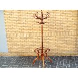 A good quality wooden coat and hat stand,