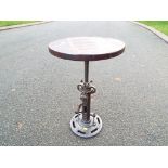 A novelty wind-up / wind-down stool with