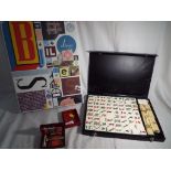 A mixed lot to include a case of Mahjong counters, a Bakelite razor, a silver toothpick,