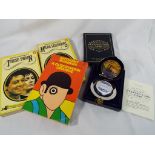 A cased set of Dalvey playing cards in white metal case and presentation box and three paperbacks,