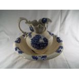 An Ironstone wash basin with matching water jug depicting a blue farmyard scene (2)