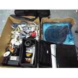 A large quantity of electric items to include cameras and camera accessories,