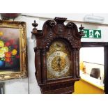 A good early 20th century Chippendale-style mahogany longcase clock,