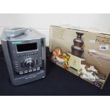 A Sony hi-fi system with remote control and a Hinari Party Time Chocolate Fountain,