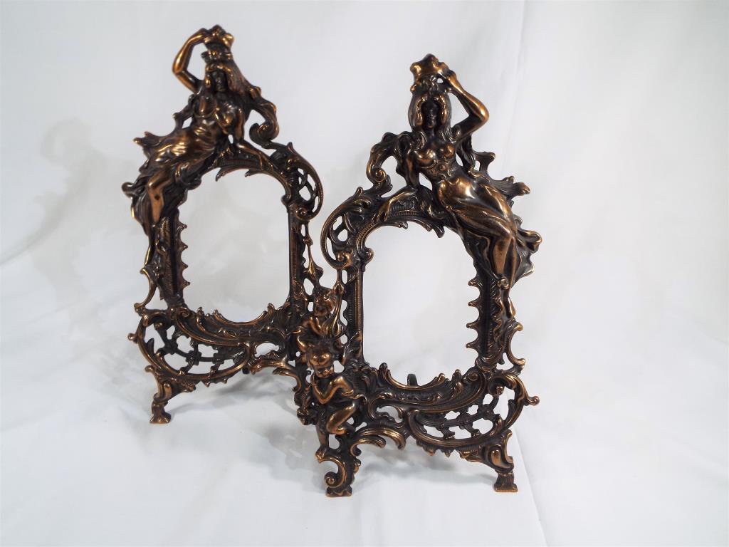 A pair of brass picture frames