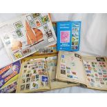 A wooden chest containing a collection of albums of world postage stamps - Est £20 - £40