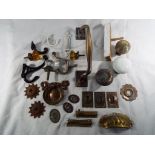 A large quantity of antique brass door fittings to include handles,