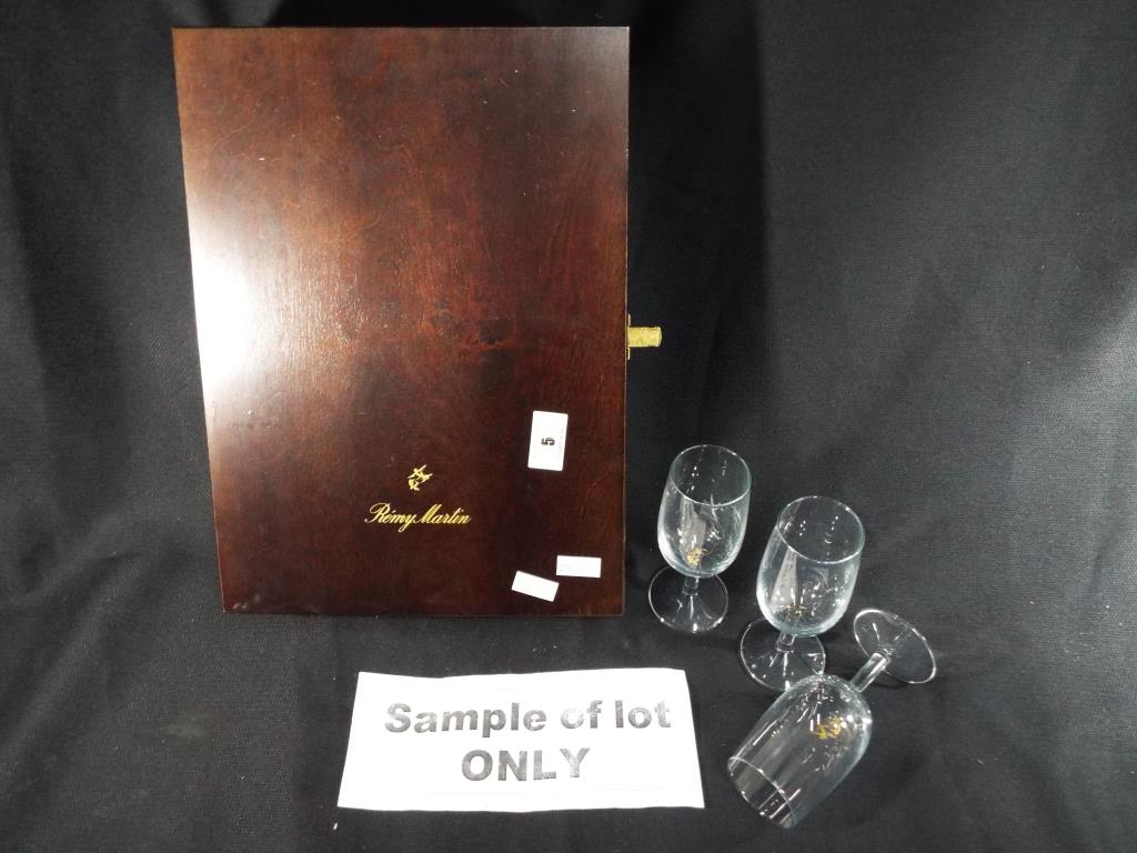 A presentation box containing six Remy Martin lead crystal brandy glasses with logo