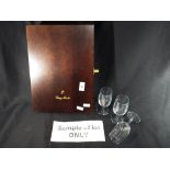 A presentation box containing six Remy Martin lead crystal brandy glasses with logo