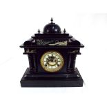 A black marble cased mantel clock,