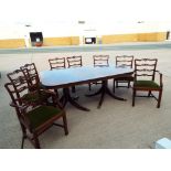 A mahogany extending dining table, 74.