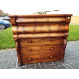 A mahogany chest of 5 drawers with mother of pearl inlaid handles.