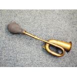 A brass car horn,