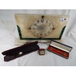 A large art deco mantle clock inlaid with malachite, a travellers clock,