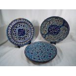 Three Antique Persian ceramic chargers,