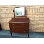 A mahogany dressing table with mirror,