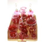 Collection of ruby glass including hand bells, trumpet spills,