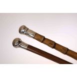 A VICTORIAN SILVER HANDLED WALKING STICK, London 1885, the handle in the shape of a champagne cork,