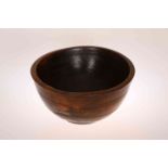 A TURNED ELM DAIRY BOWL, PROBABLY 19TH CENTURY, with slight collar and incised bands.