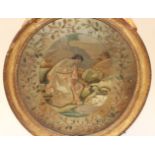 A GEORGE III SILKWORK PICTURE, slightly oval, of a lady feeding two swans in a landscape,
