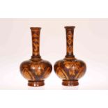 A PAIR OF TREEN VASES WITH POKERWORK DECORATION, of bottle form, decorated with strapwork,