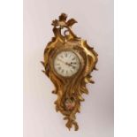 A GILT BRONZE CARTEL CLOCK, in the Rococo style, cast with scrolling acanthus,