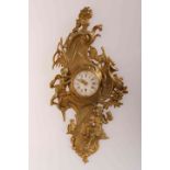 A GILT BRONZE CARTEL CLOCK, in the Rococo style, cast with putti, birds, scrolls and foliage,