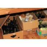 Four boxes of vintage glass bottles,