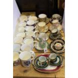 Collection of cabinet cups and saucers and commemorative mugs