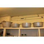Four large aluminium pans