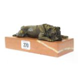 Bronze model of a recumbent dog
