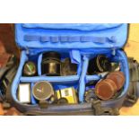 Camera bag, containing lenses, flash, tripod,