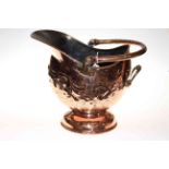 Highly polished copper swing handled coal scuttle with embossed decoration