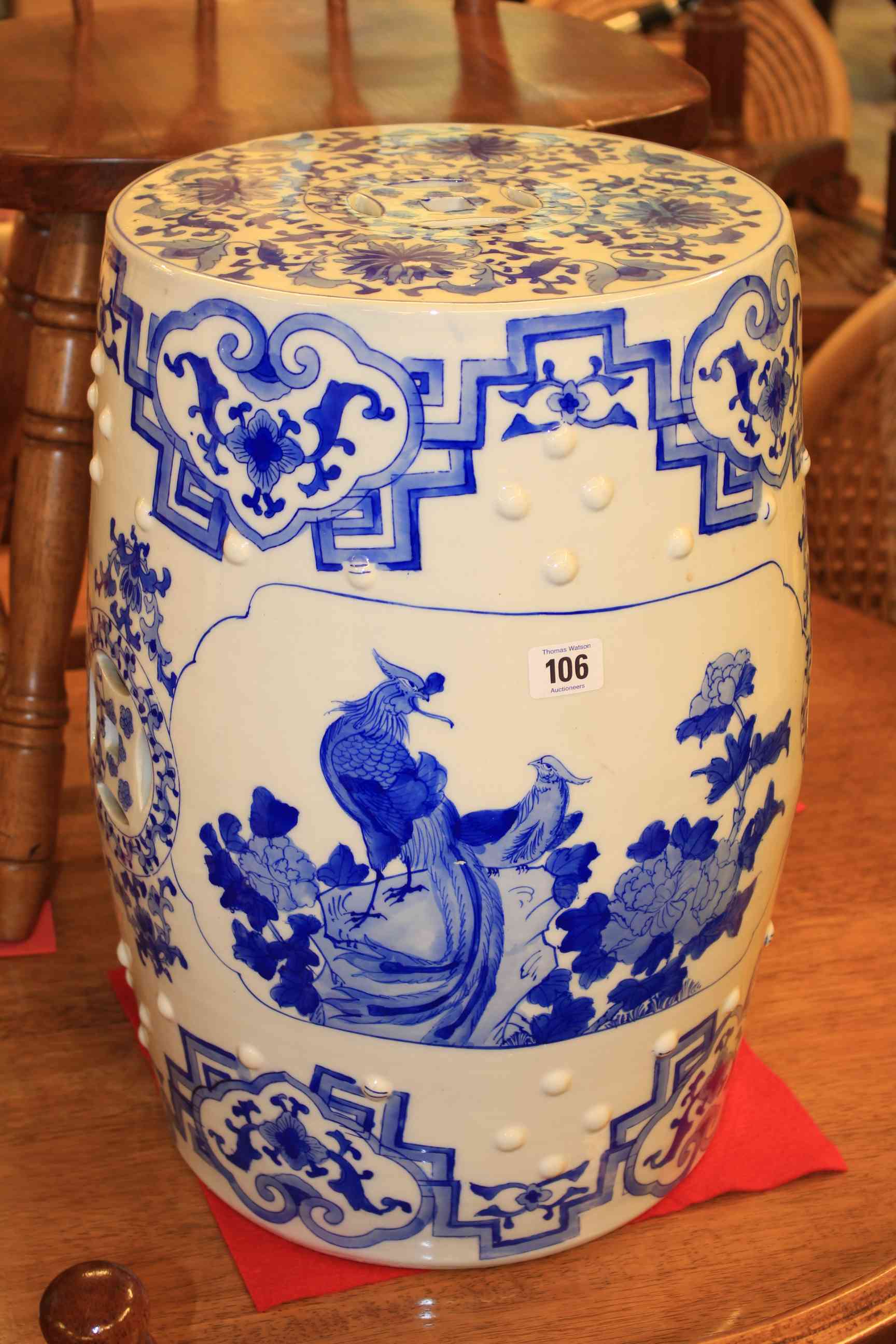 Chinese blue and white pottery circular garden seat decorated with bird panels and floral borders