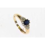 Gold ring set with a blue stone