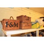 Three wicker picnic baskets, including two Fortnum & Mason,