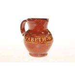Slipware jug, inscribed Elizabeth Weekes,
